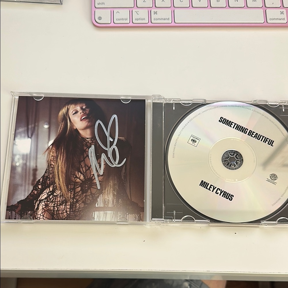Miley Cyrus 'Something Beautiful' CD with Autographed Cover